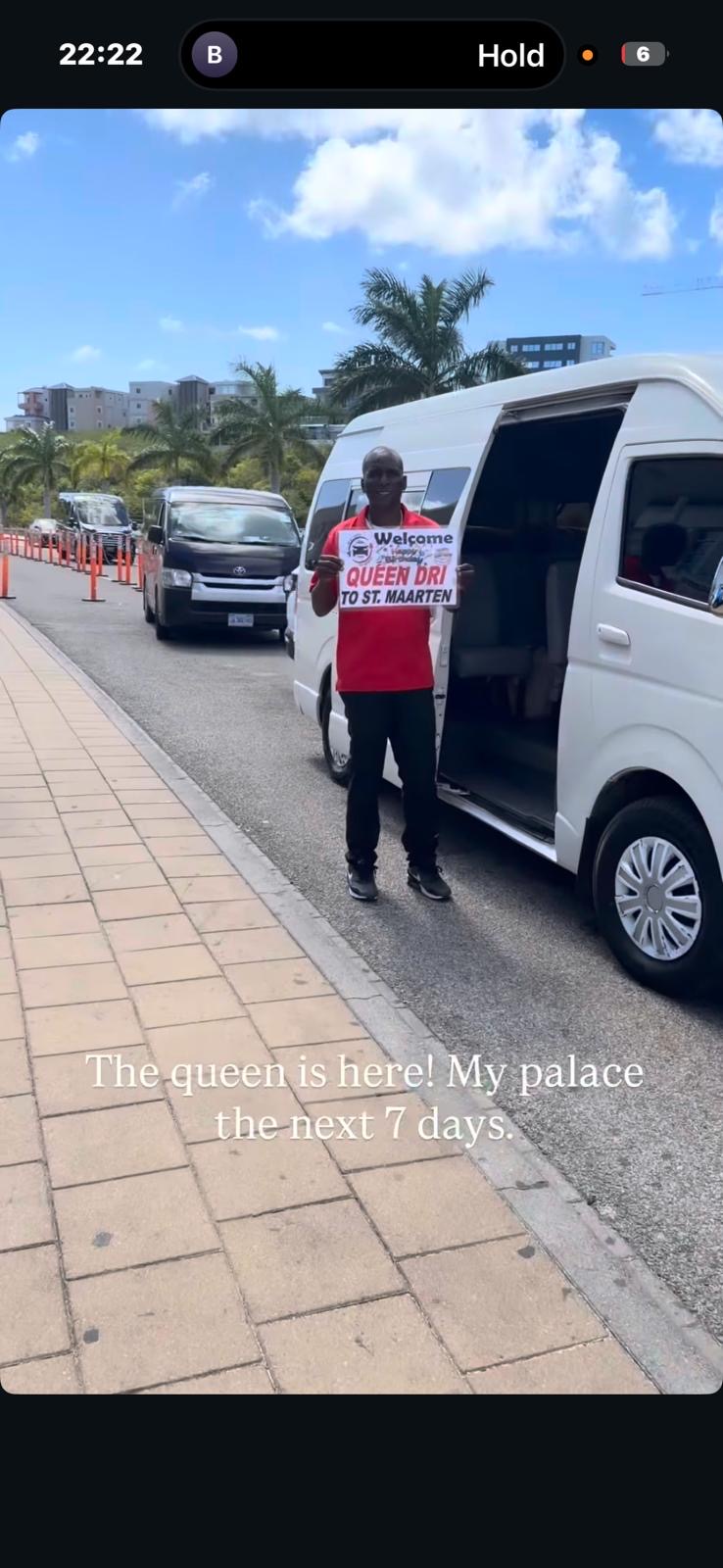 Andy holding a personalized welcome sign at SXM airport